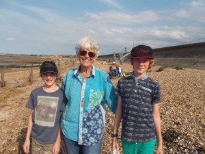 Sheila with her great nephews at the caravan beach