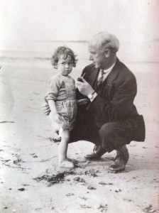 My grandfather (appropriately dressed???) with my father on the beach