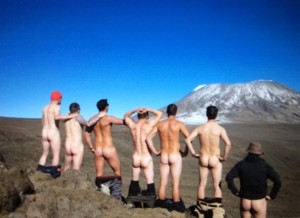 Naked men looking at Kilimanjaro