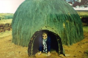 Paula in a thatched hut