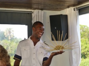 A handsome waiter and crocodile kebabs