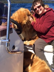 Mary on the boat with the dogs