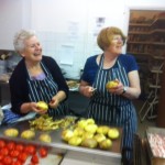 Paula and Christine in the kitchen sporting new flame-proof pinnies