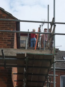 Sheila up on the scaffolding with our lovely painter, Marcus